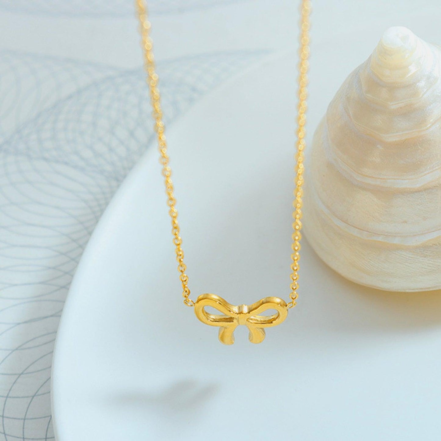 Gold-Plated Titanium Steel Bow Pendant Necklace Carauana Store